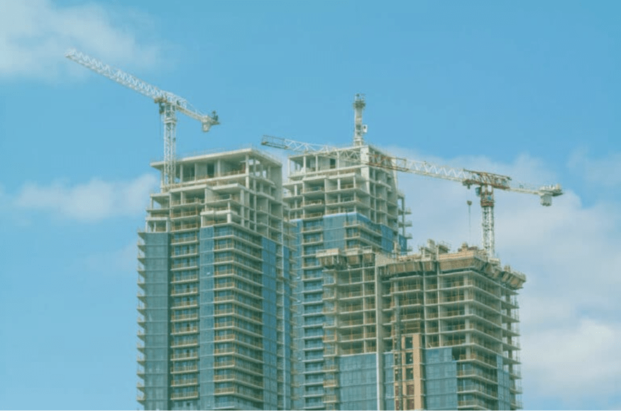 Cranes on top of a skyscraper